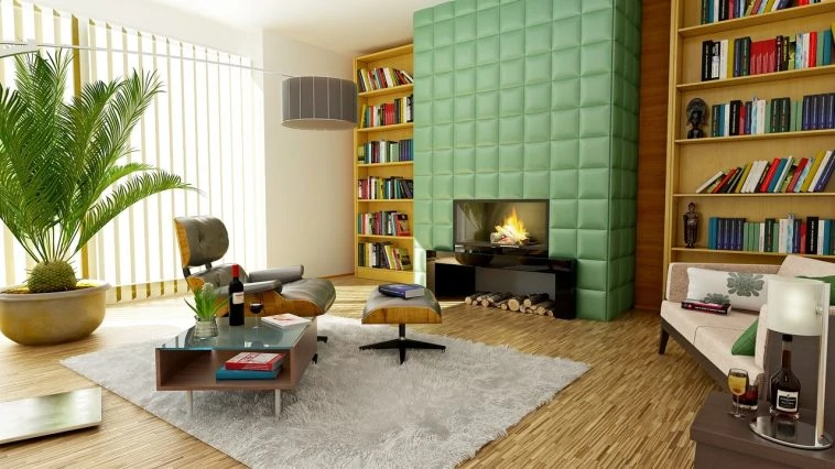Un salon avec murs verts et étagères.